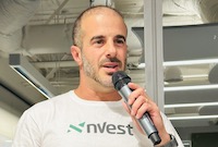 nVest founder Sivan Atad speaking into a microphone